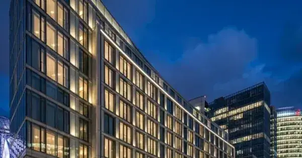 Contemporary multi-storey building facade against an evening sky